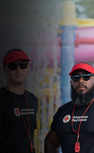 Two lifeguards participating in the Red Cross training program