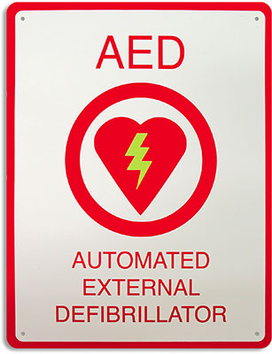 An AED wall sign with an image of a heart with a lightning bolt and the text “AED Automated External Defibrillator”.