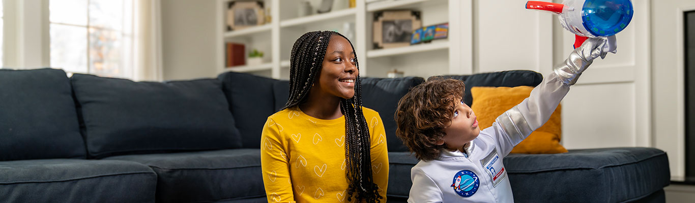 Babysitter playing games with a child.