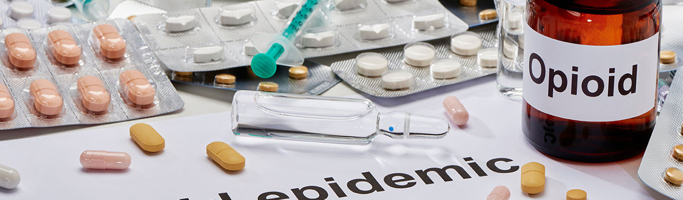 Prescription medications and opioid bottles.