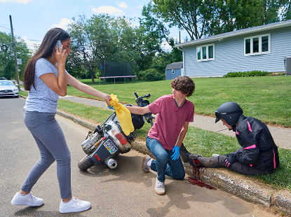 Motorcycle accident first aid performed by high school student