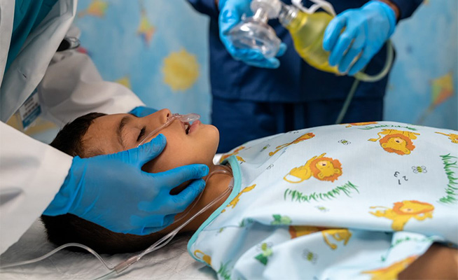 Procedural sedation being performed on a toddler.