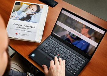 Male Hands and Profile with Laptop and PALS Manual
