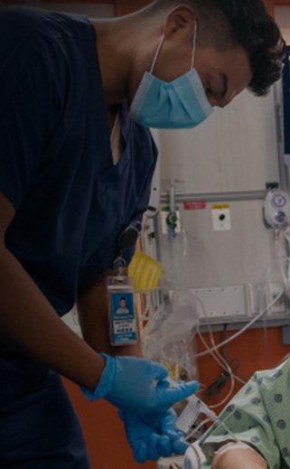 Procedural sedation being performed by a male in a healthcare facility.