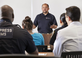 Man Speaking to Group at Podium