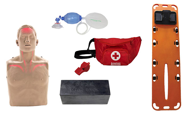 Lifeguarding training equipment - jaw thrust manikin, bag valve mask, diving brick, backboard, and hip pack.