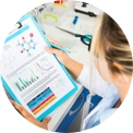 female looking at graphs on sheet of paper
