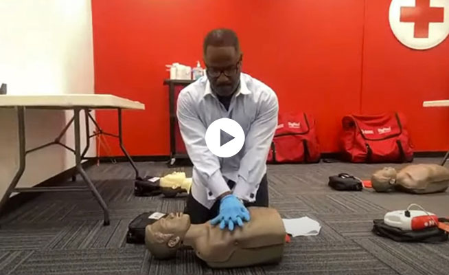 Student practicing CPR compressions in the What to Expect in your Red Cross CPR/AED Class video.