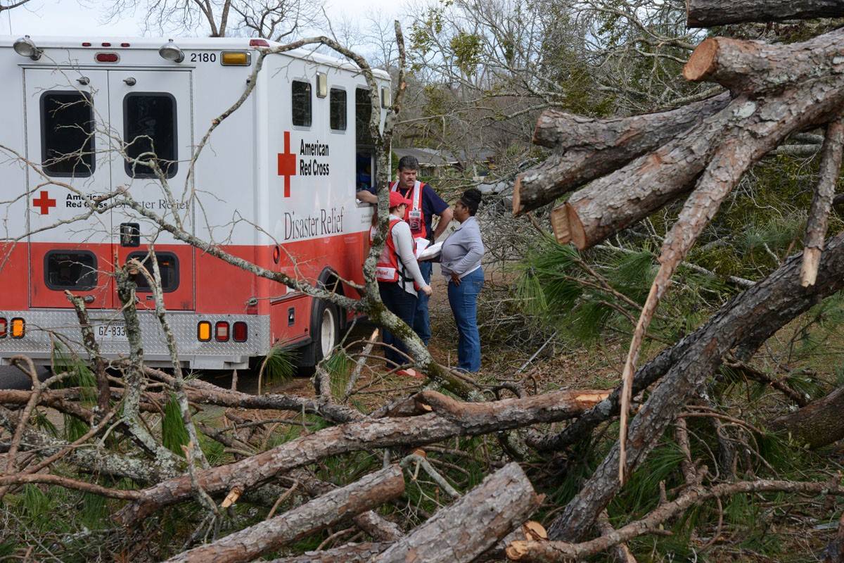 January 26, 2017. Albany, Georgia. Southern Tornadoes and Storms.
Red Cross volunteers talk with April Turner as she begins to recover from the storm. “This is when you see all of the good in people come out,” April said. 
Photo by Daniel Cima for the American Red Cross, Red Cross Helps in Southern States Recovering from Severe Weather