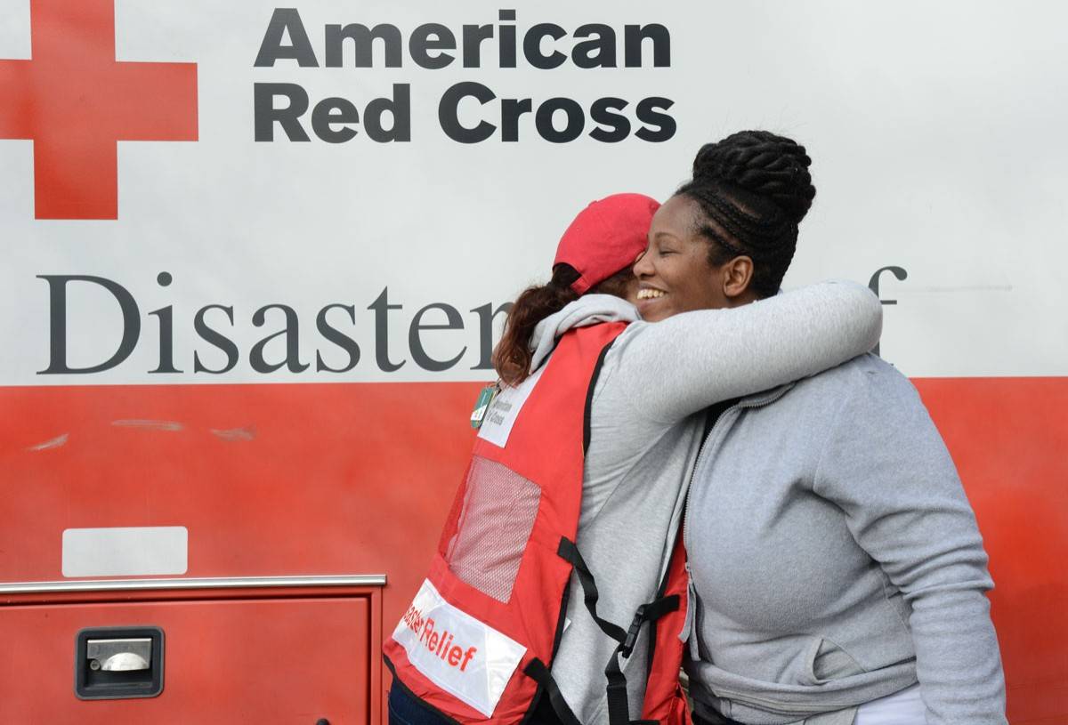 January 26, 2017. Albany, Georgia. Southern Tornadoes and Storms.
Red Cross volunteers talk with April Turner as she begins to recover from the storm. “This is when you see all of the good in people come out,” April said. 
Photo by Daniel Cima for the American Red Cross, Red Cross Helps in Southern States Recovering from Severe Weather