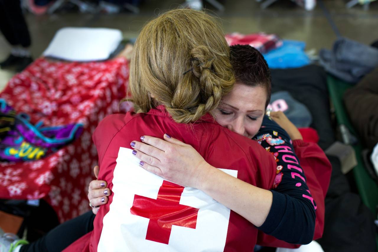 February 15, 2017. Chico, California.
Sabreen and Emily meet and hug at the Red Cross shelter in Chico, CA. Sabreen had to evacuate her home in Oroville and is staying at the shelter. Sabreen has also helped out at the shelter by running games and activities for the kids staying there.
Photo by Marko Kokic for the American Red Cross, Oroville Evacuations to Red Cross Shelters