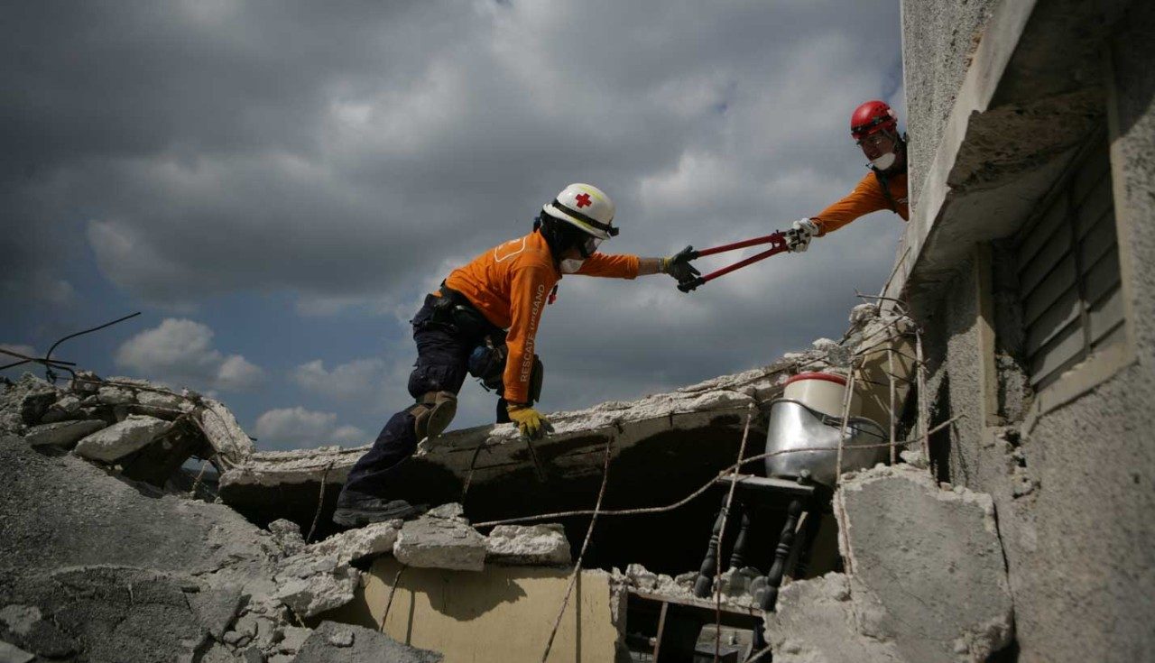 Workers conduct search and rescue efforts after earthquake