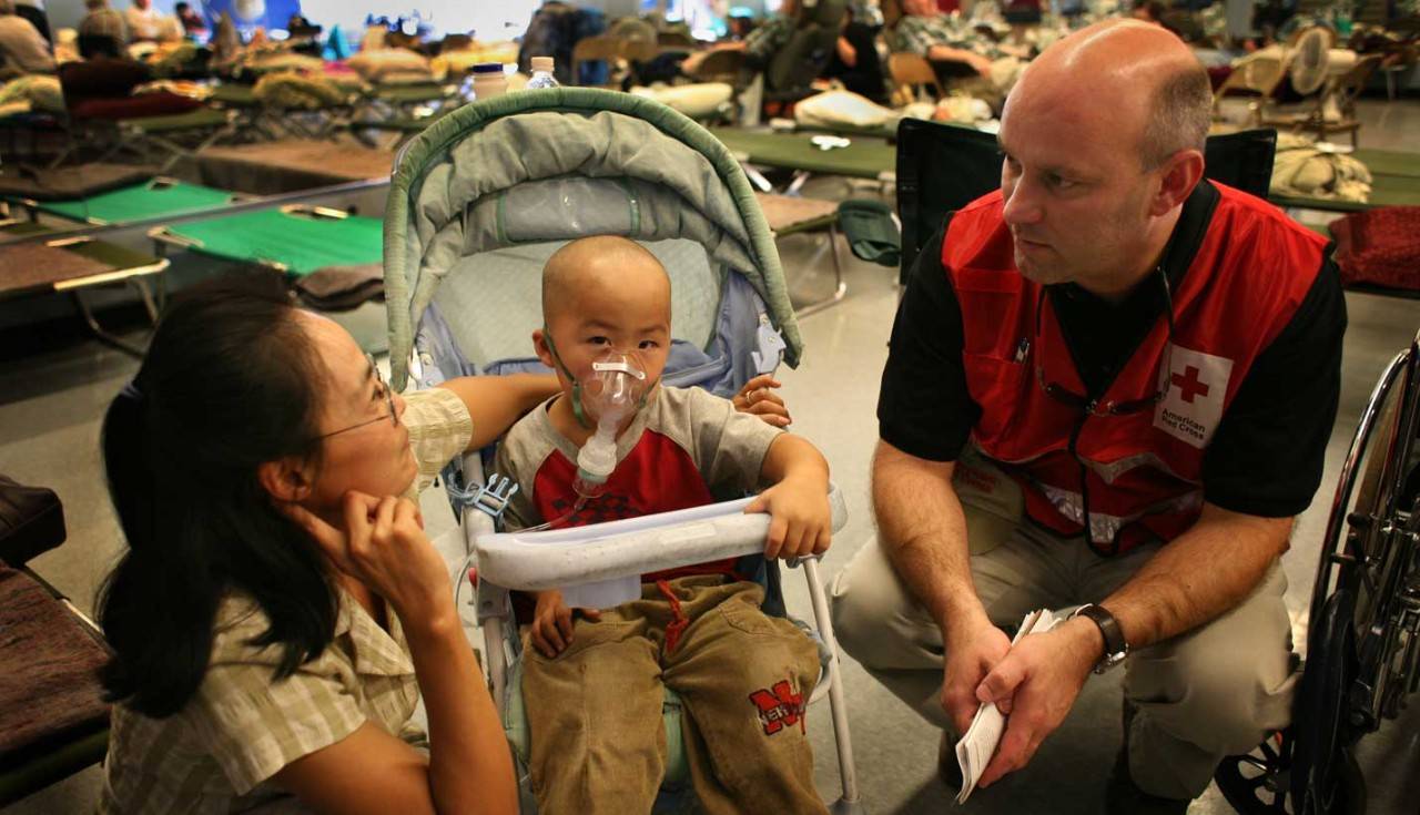 Volunteer providing medical assistance in wildfire shelter