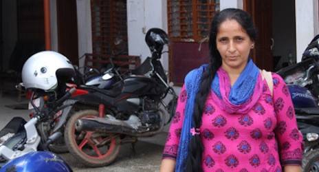 Devaki Poudel, Red Cross volunteer, stands in front of the Nuwakot district chapter office following social mobilization training on the upcoming measles and rubella campaign in Nepal.