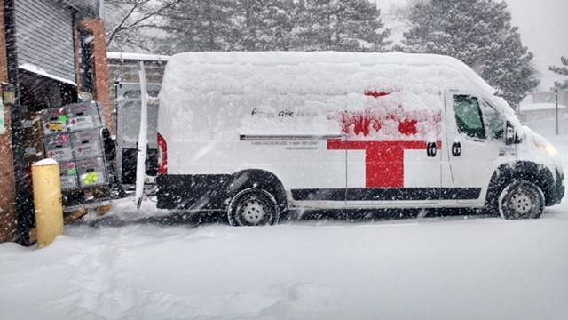 Blood Collection Vehicle covered in snow