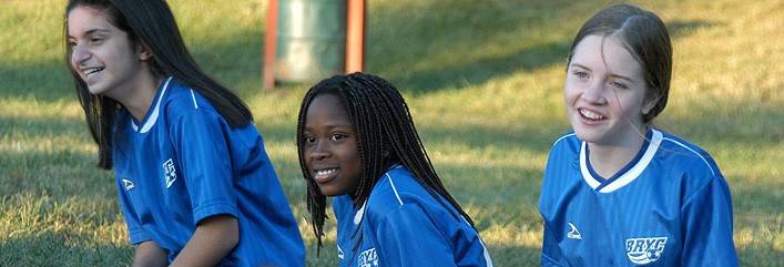 Three girls at soccer practice, cropped