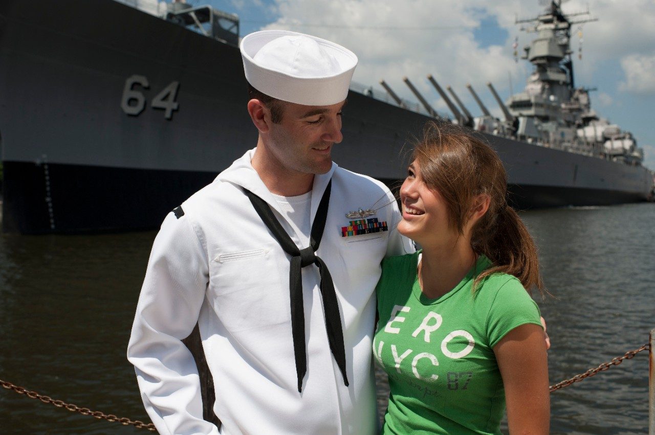 Woman and Navy Officer stand together