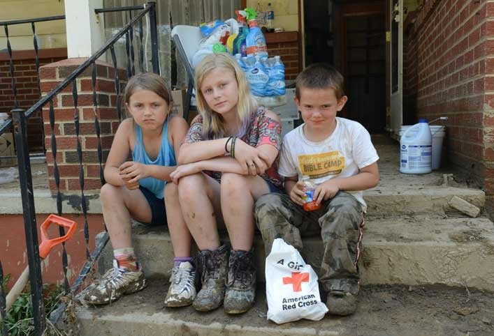 Young kids sitting on porch