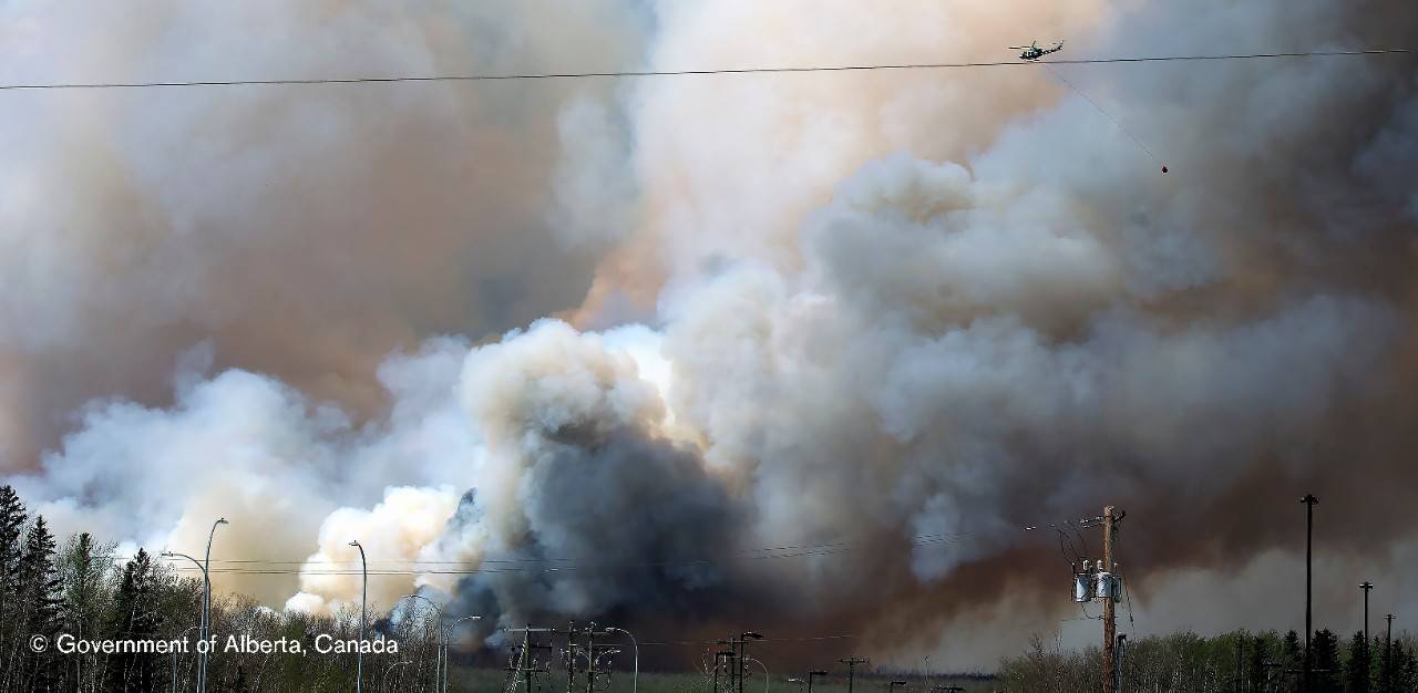 Wildfires continue to threaten Fort McMurray neighbourhoods on Wednesday, May 4, 2016. (photograph by Chris Schwarz/Government of Alberta), Canada wildfire designation version 1 medium