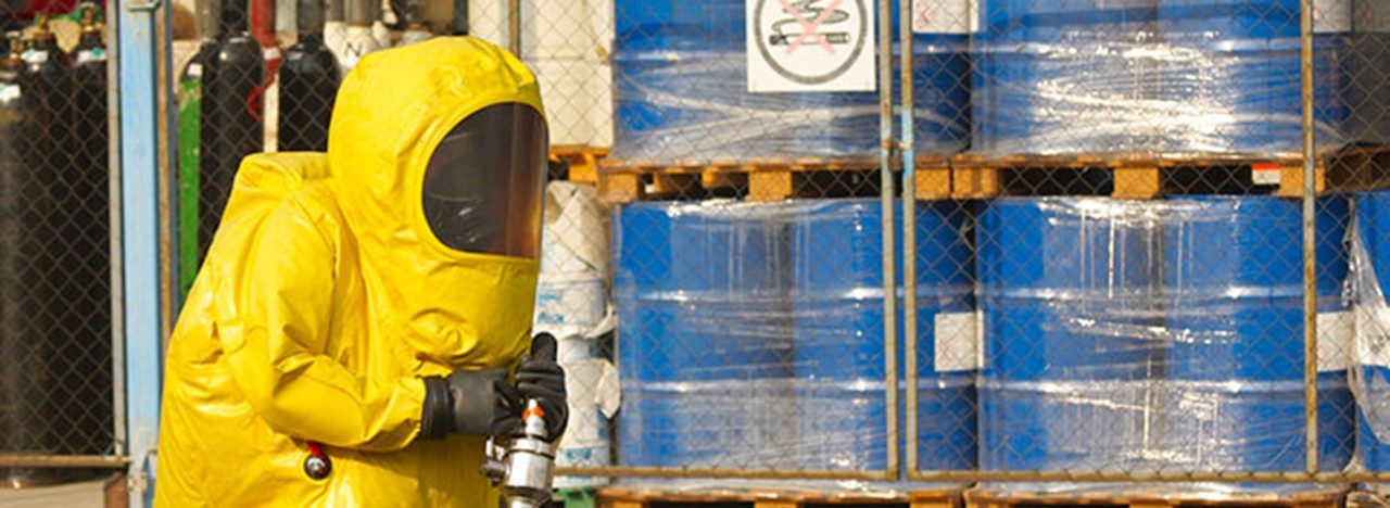 A person wearing hazmat gear to protect them from harmful chemicals.