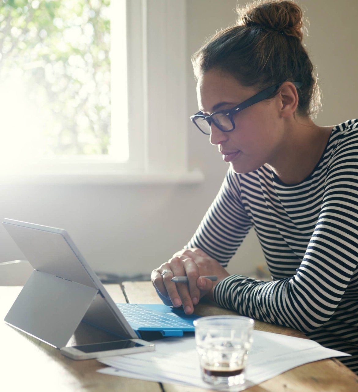 Woman at home working on laptop