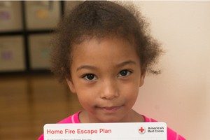 Girl holds up Home Fire Escape Plan