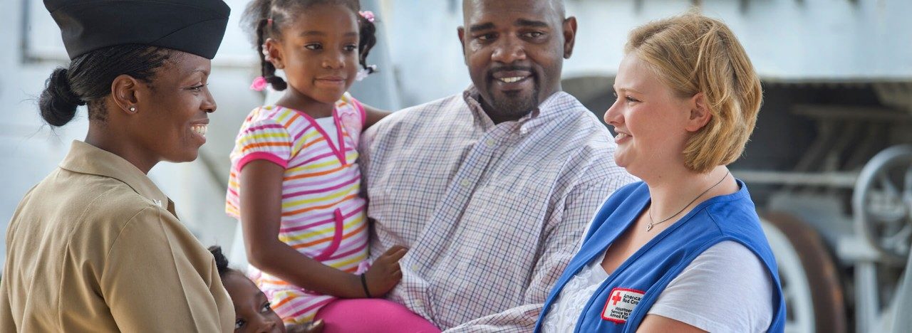 Military family with American Red Cross volunteer