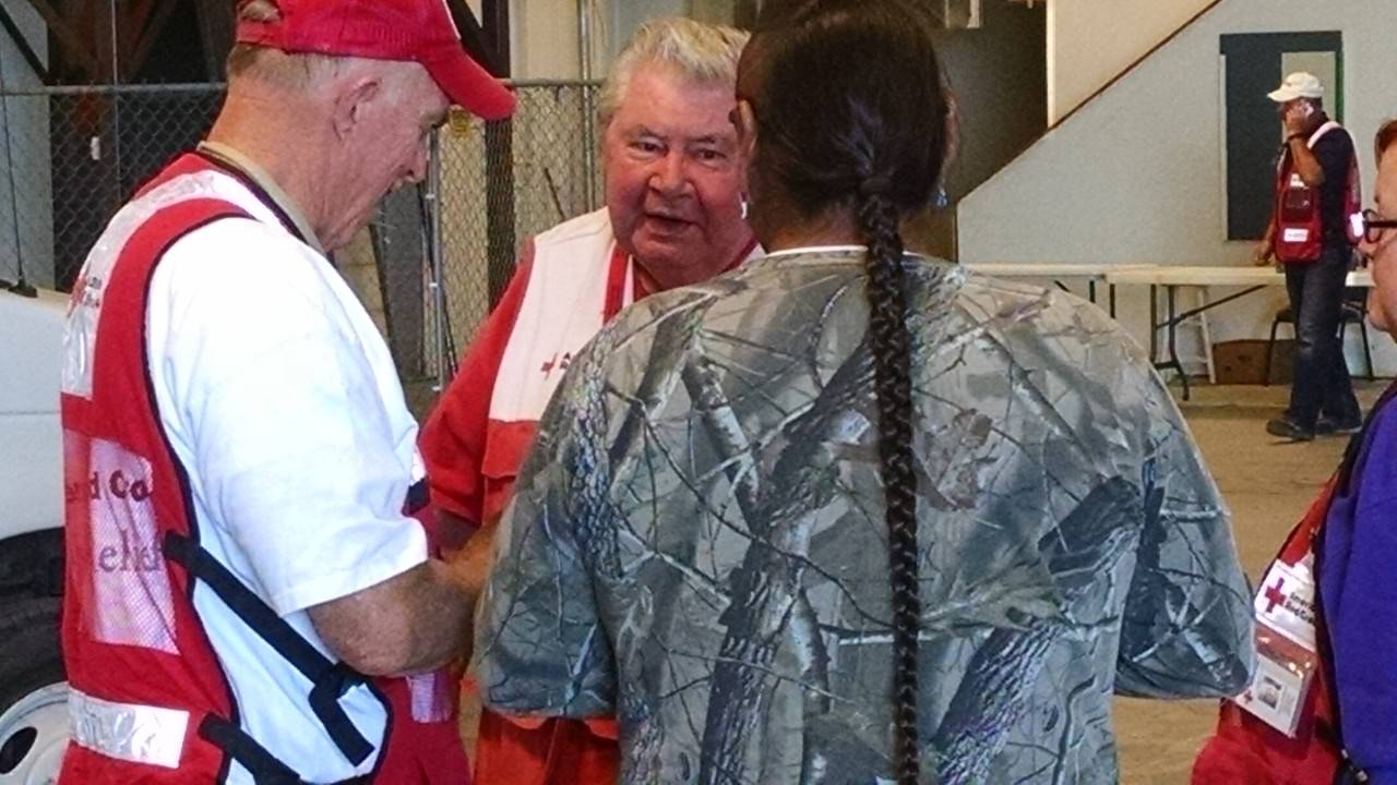 Red Cross volunteers support wildfire evacuees in a shelter in Browning, Montana.