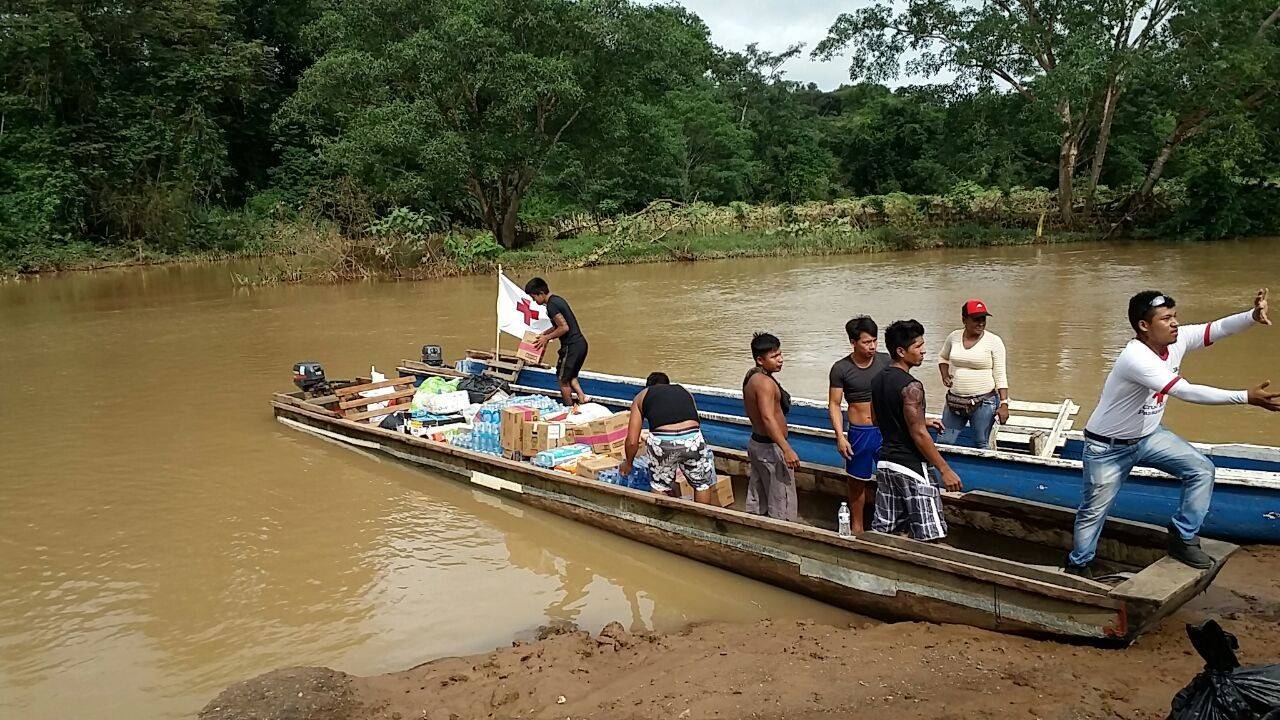 Red Cross workers transport food and water to Emberá indigenous communities that were affected by Hurricane Otto in Colón, Panama at the Gatún river.