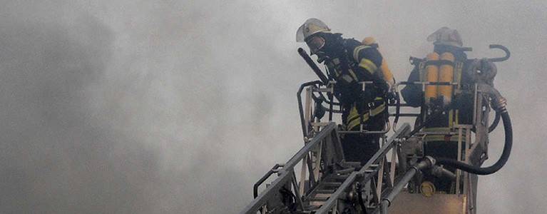 Fire fighters on ladder