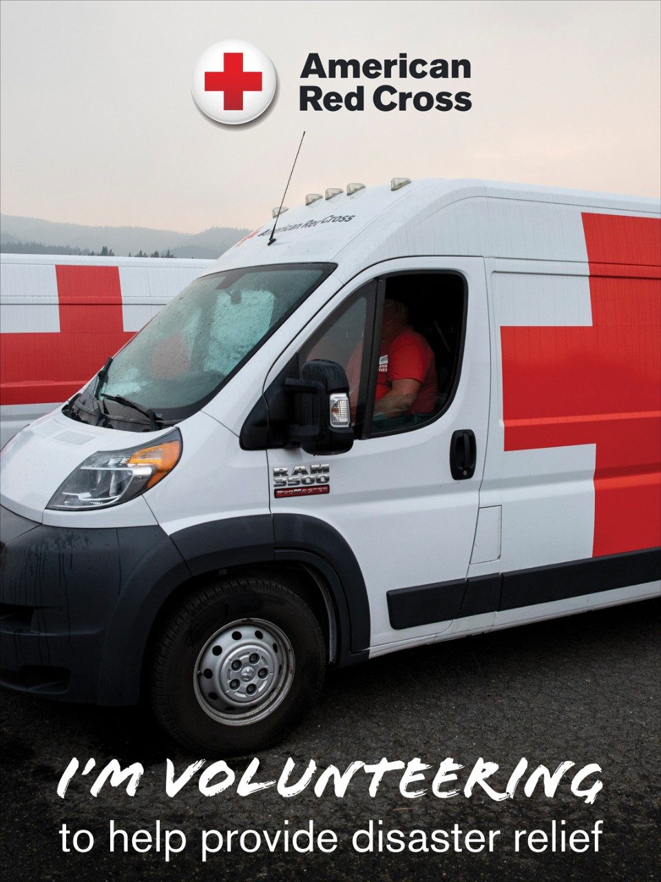 Text reads: I'm Volunteering to help provide disater relief, on top of photo of an emergency response vehicle
