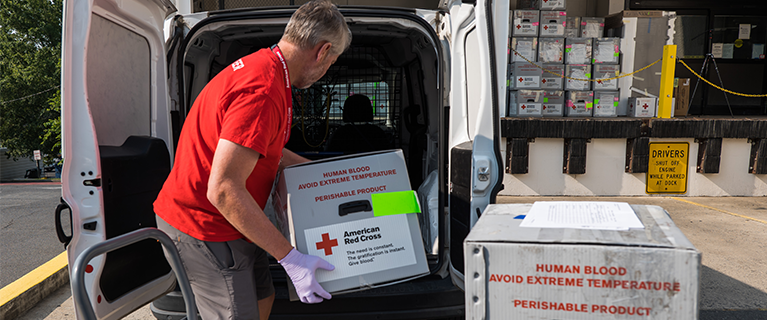 red cross volunteer welcoming donors in their role as a blood donor ambassador