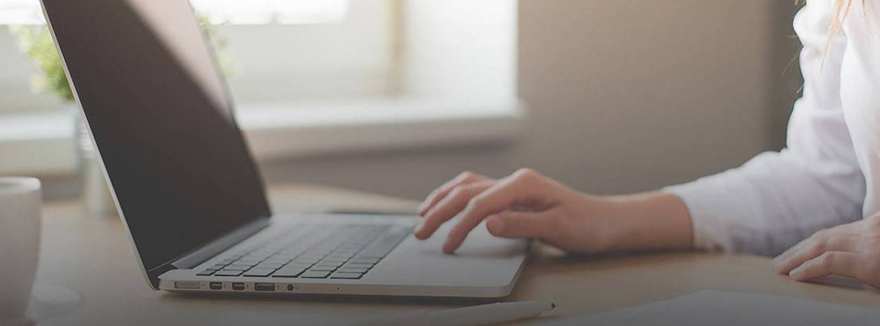 Woman typing on laptop computer