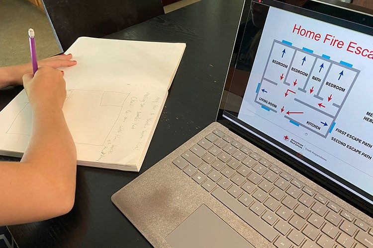 Laptop screen displaying a home fire escape plan