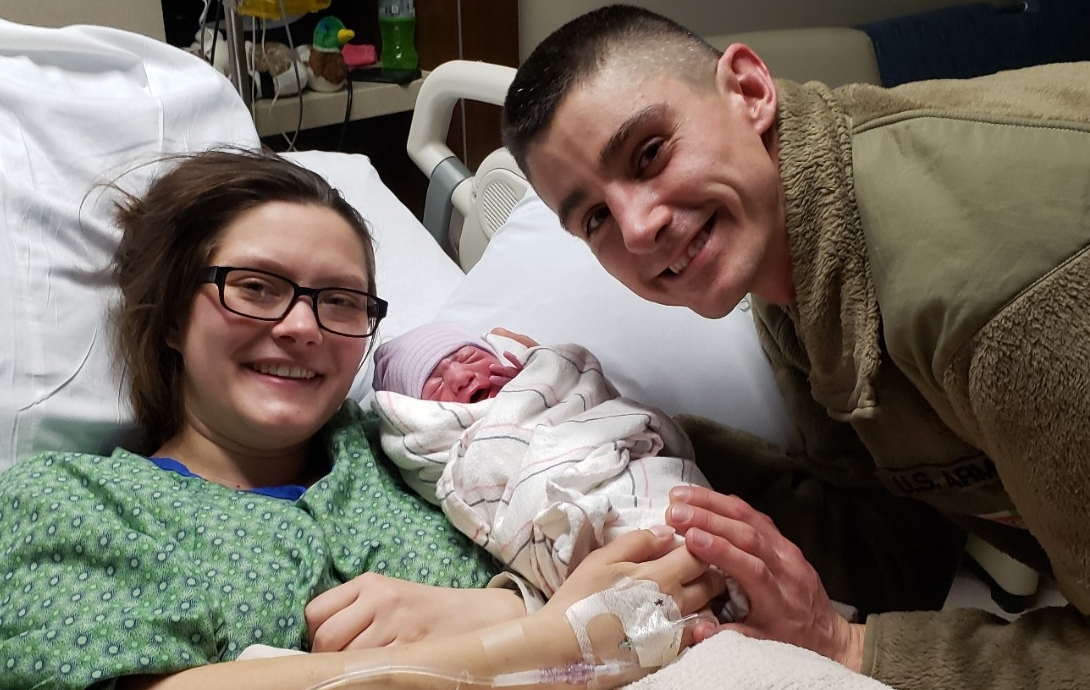 Sergeants Cory Hicks and Shanyn France with new baby