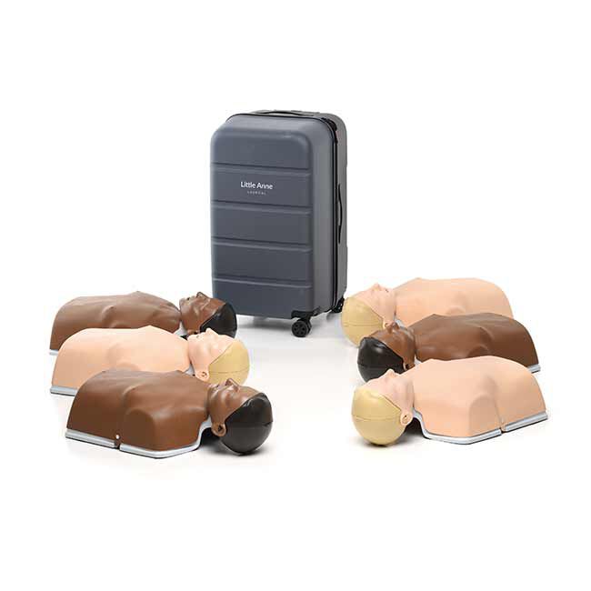 3 Brown Little Anne QCPR Enabled Adult CPR Manikins and 3 Tan Little Anne QCPR Enabled Adult CPR Manikins Laid Flat Next to a Carrying Case.