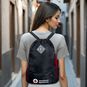 A person wearing the American Red Cross Drawstring Backpack.