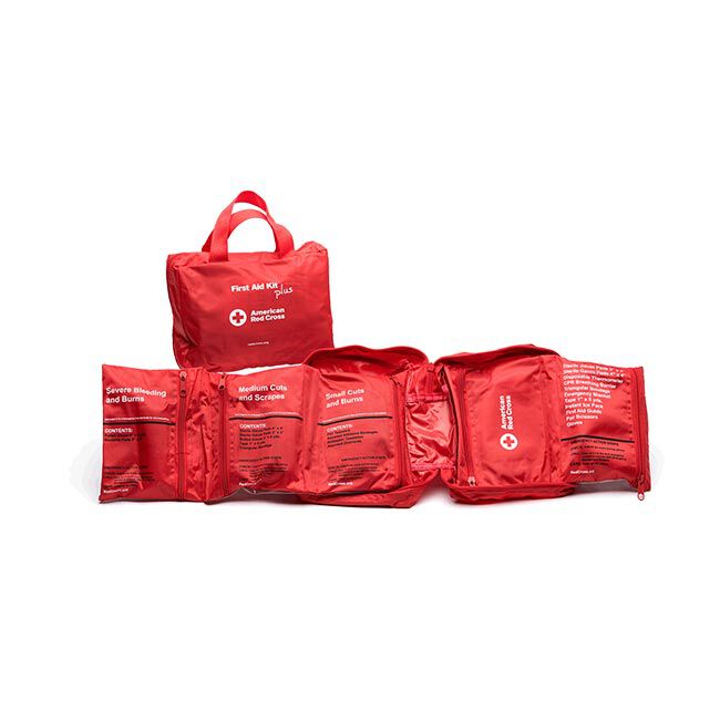 First Aid Kit PLUS shown opened up with labeled pockets for severe bleeding and burns, medium cuts and scrapes, small cuts and burns, and list of contents.
