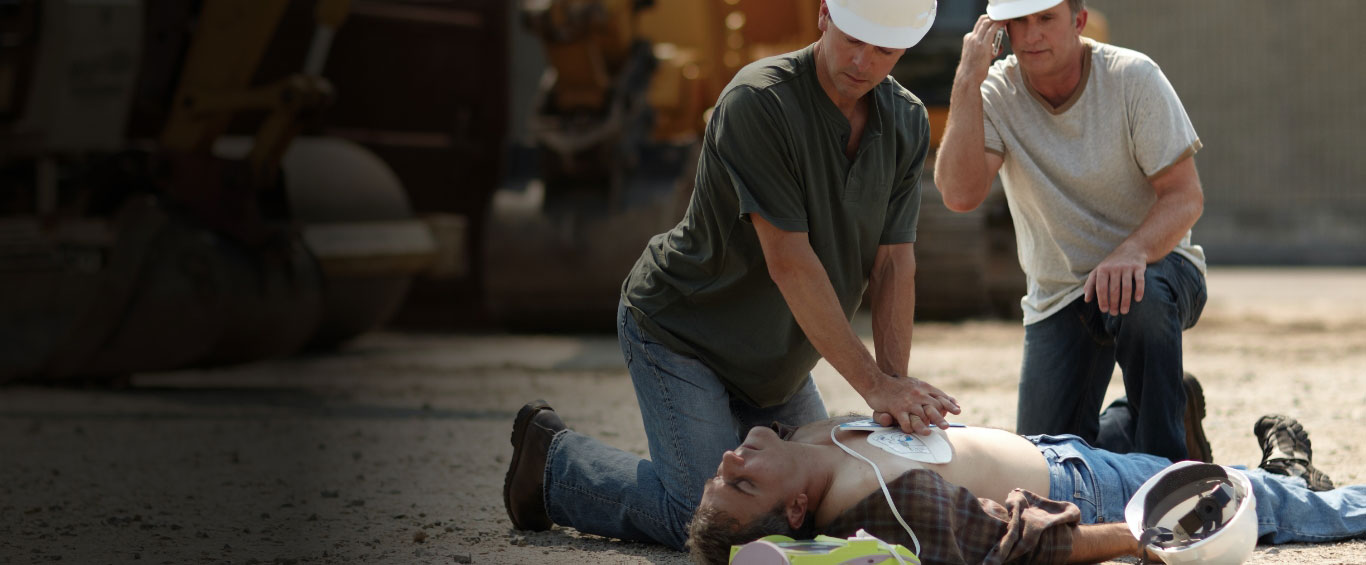 Construction worker performing CPR in the workplace